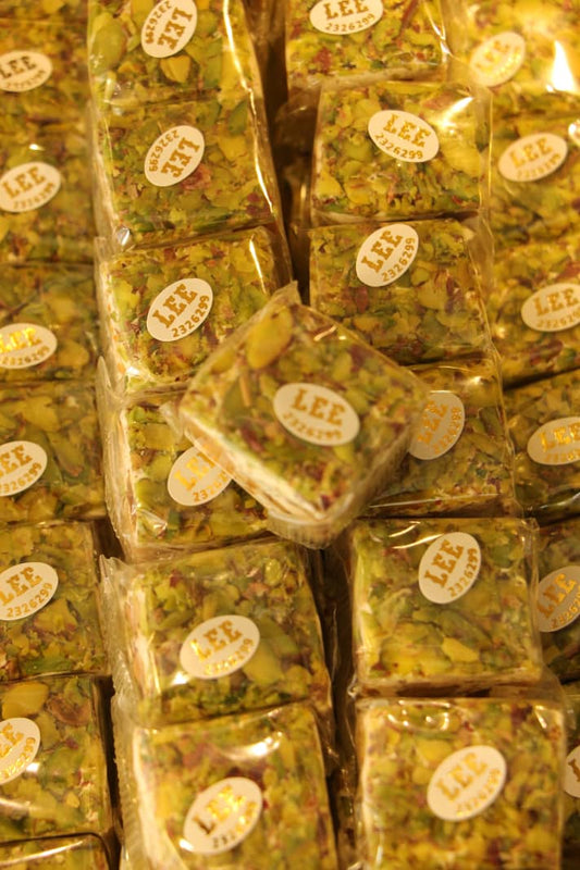 من السلوى باللوز والفستق الحلبي ( 1/2 كغ )