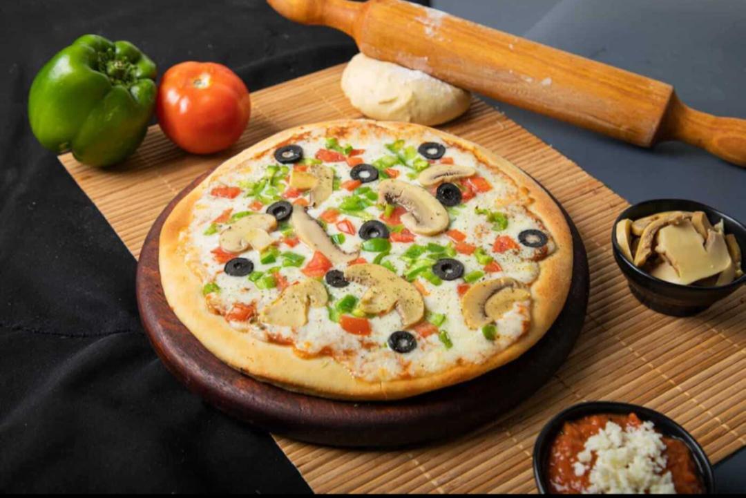 بيتزا  الفصول الأربعة